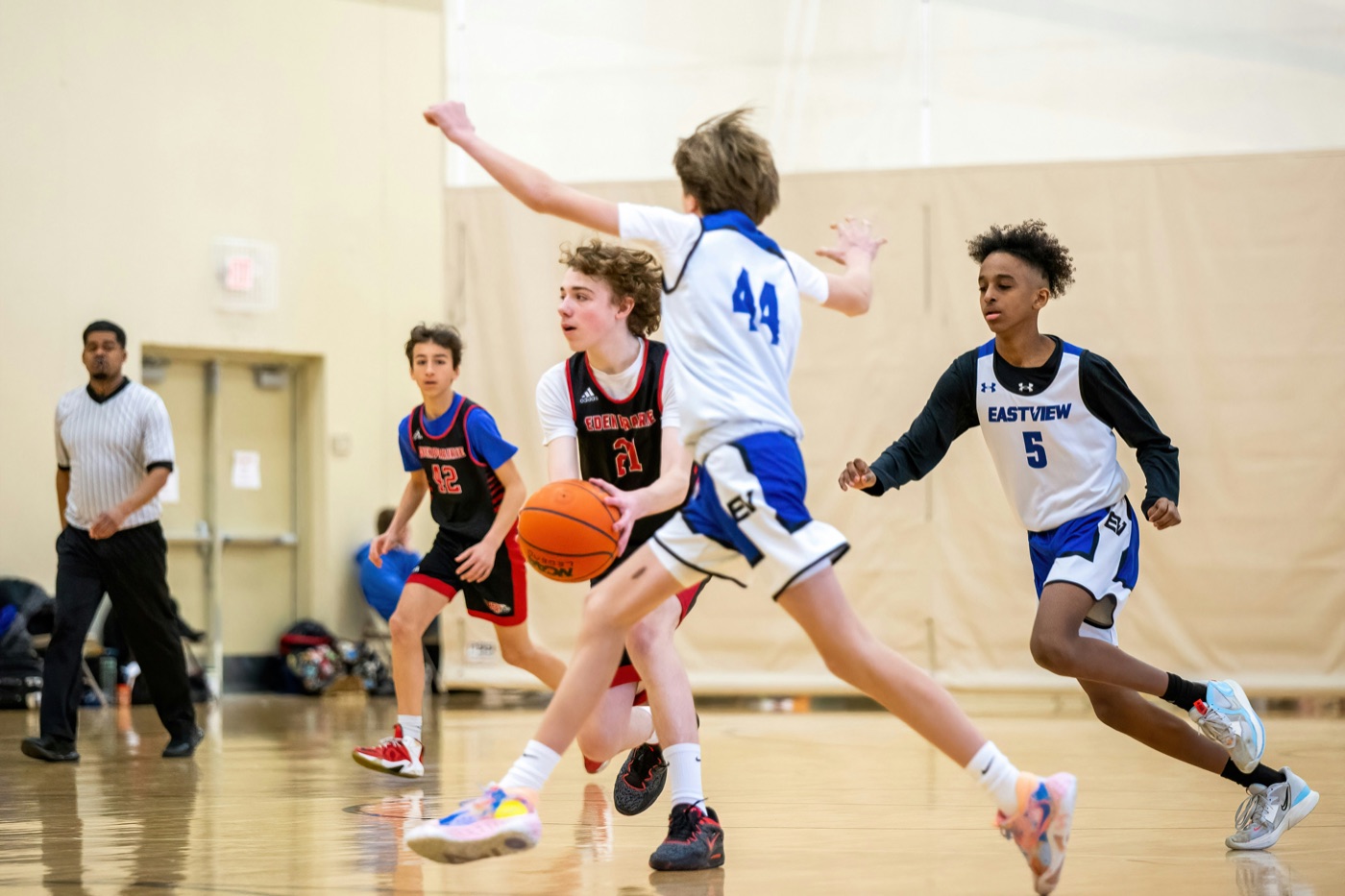 Kids playing youth basketball